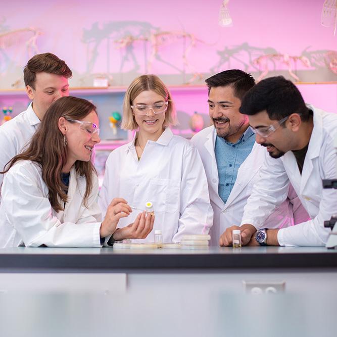 A group of happy people in a lab.